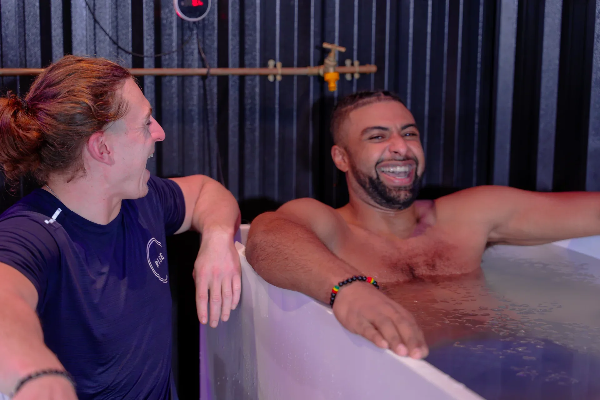 Two R1SE members sharing a cold-plunge session
